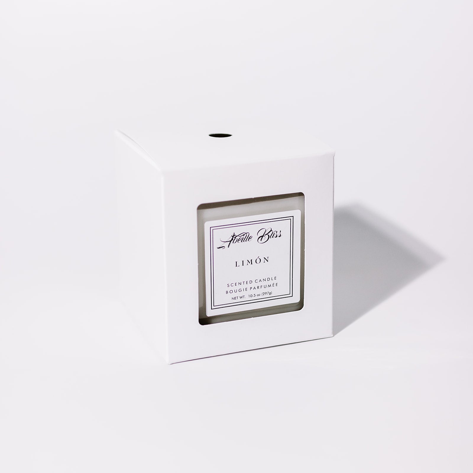 Lemon scented candle in its white classic box.