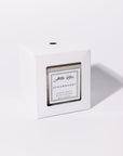 Strawberry fruity candle in its white classic box.